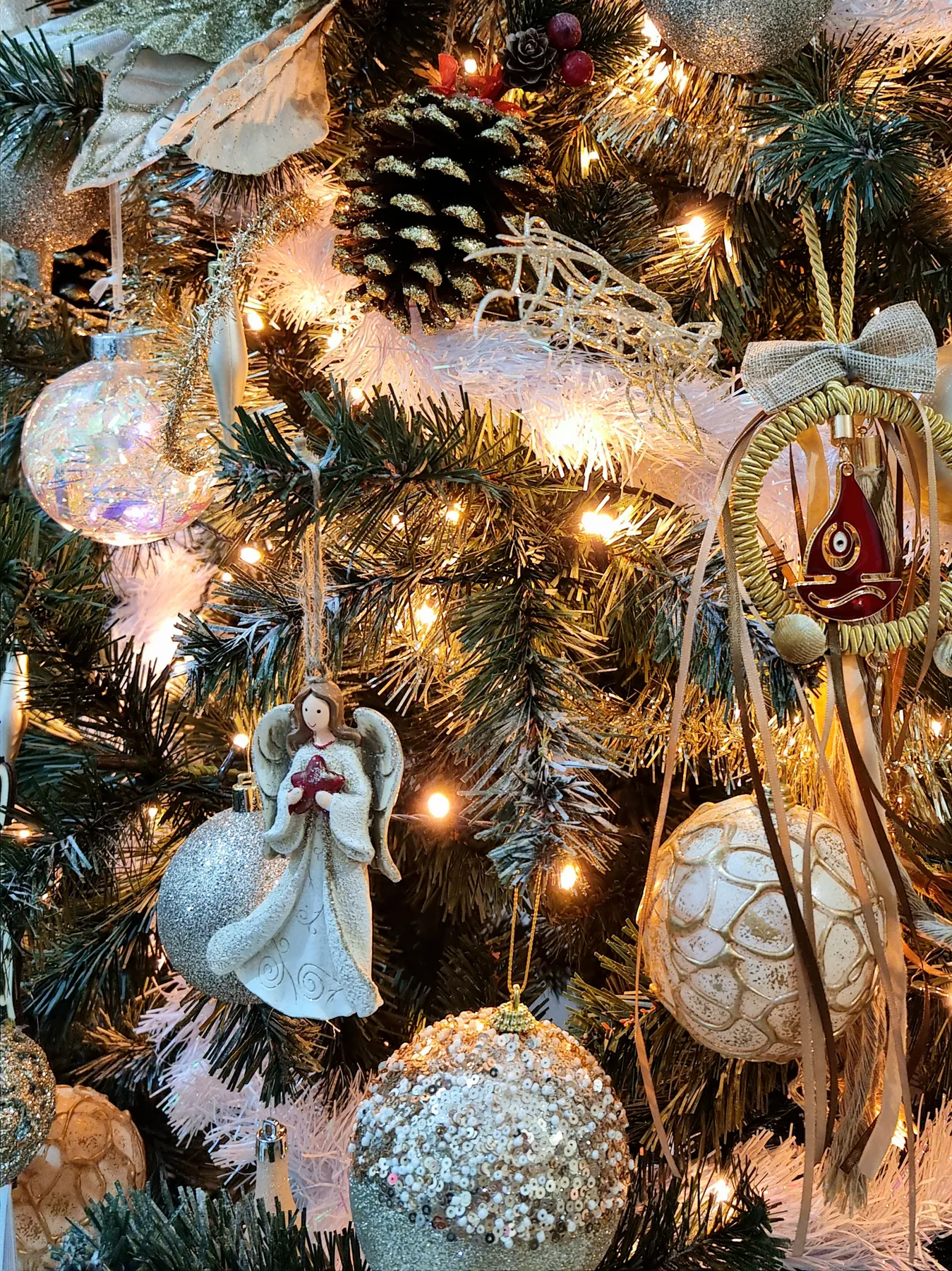 Close-up of festive Christmas ornaments and lights on a decorated tree in Chios, Greece.