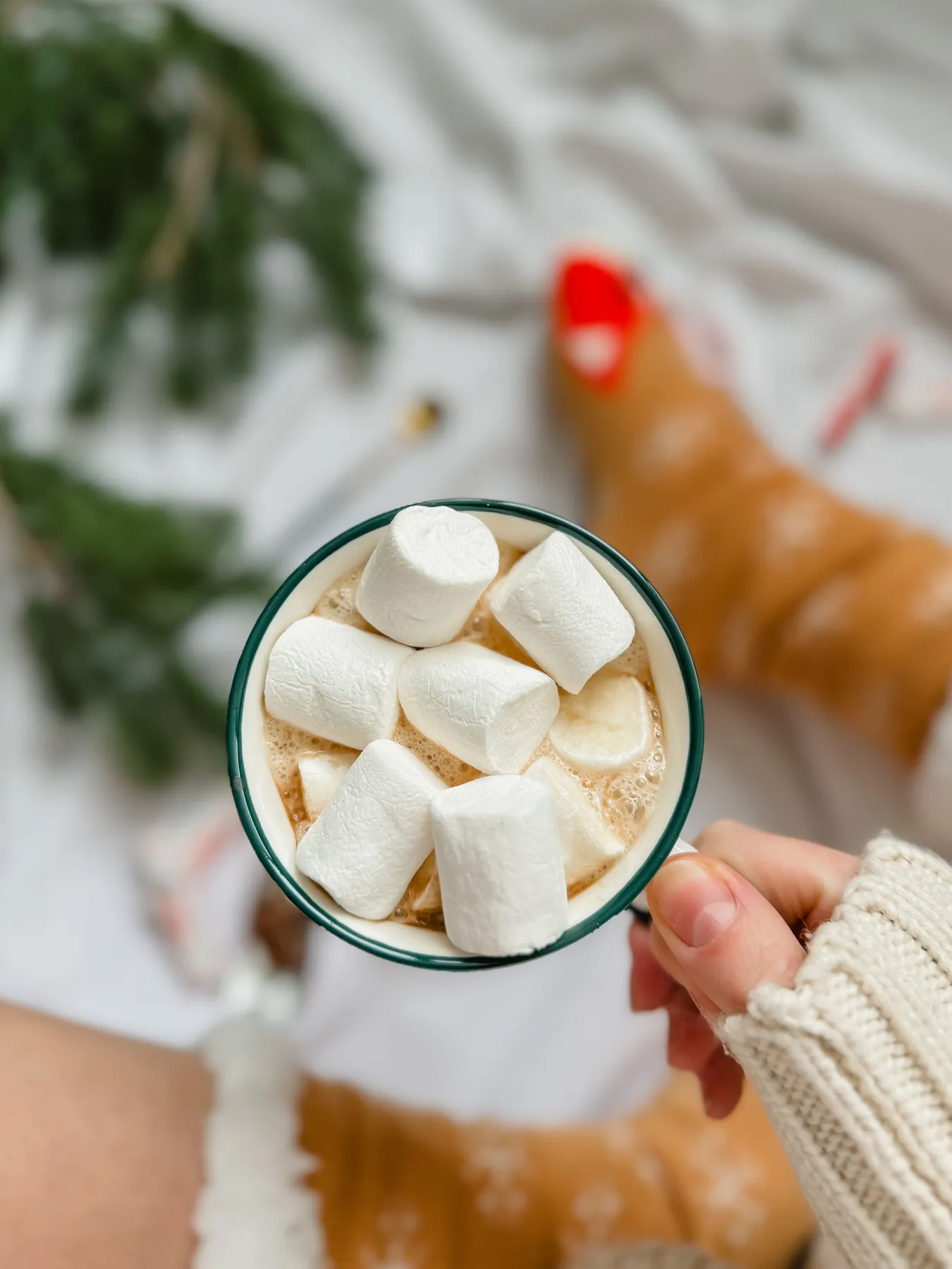 Close-up of hot chocolate with marshmallows, evoking a cozy winter vibe.