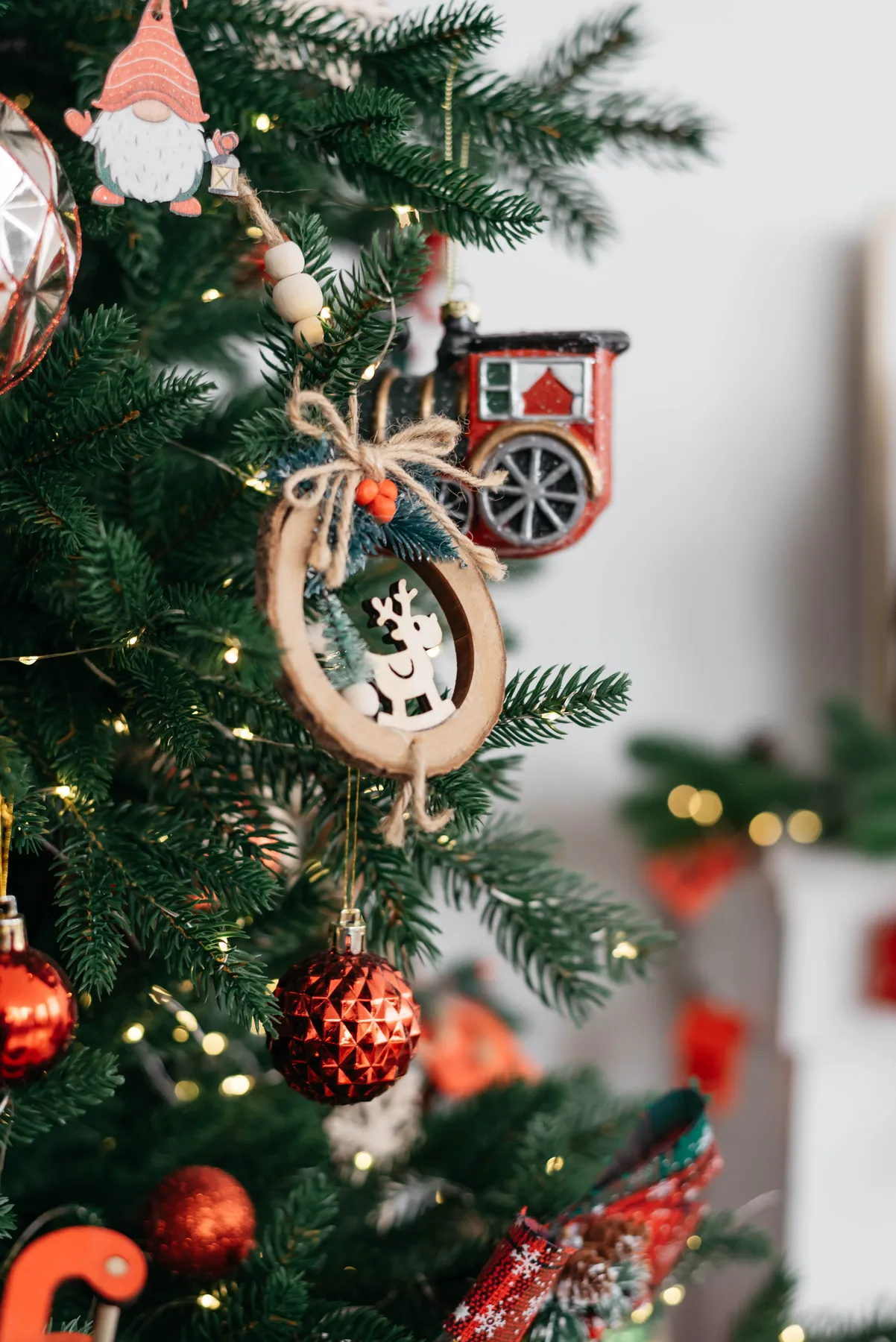 Decorative Christmas tree with festive ornaments and lights creating a holiday ambiance.