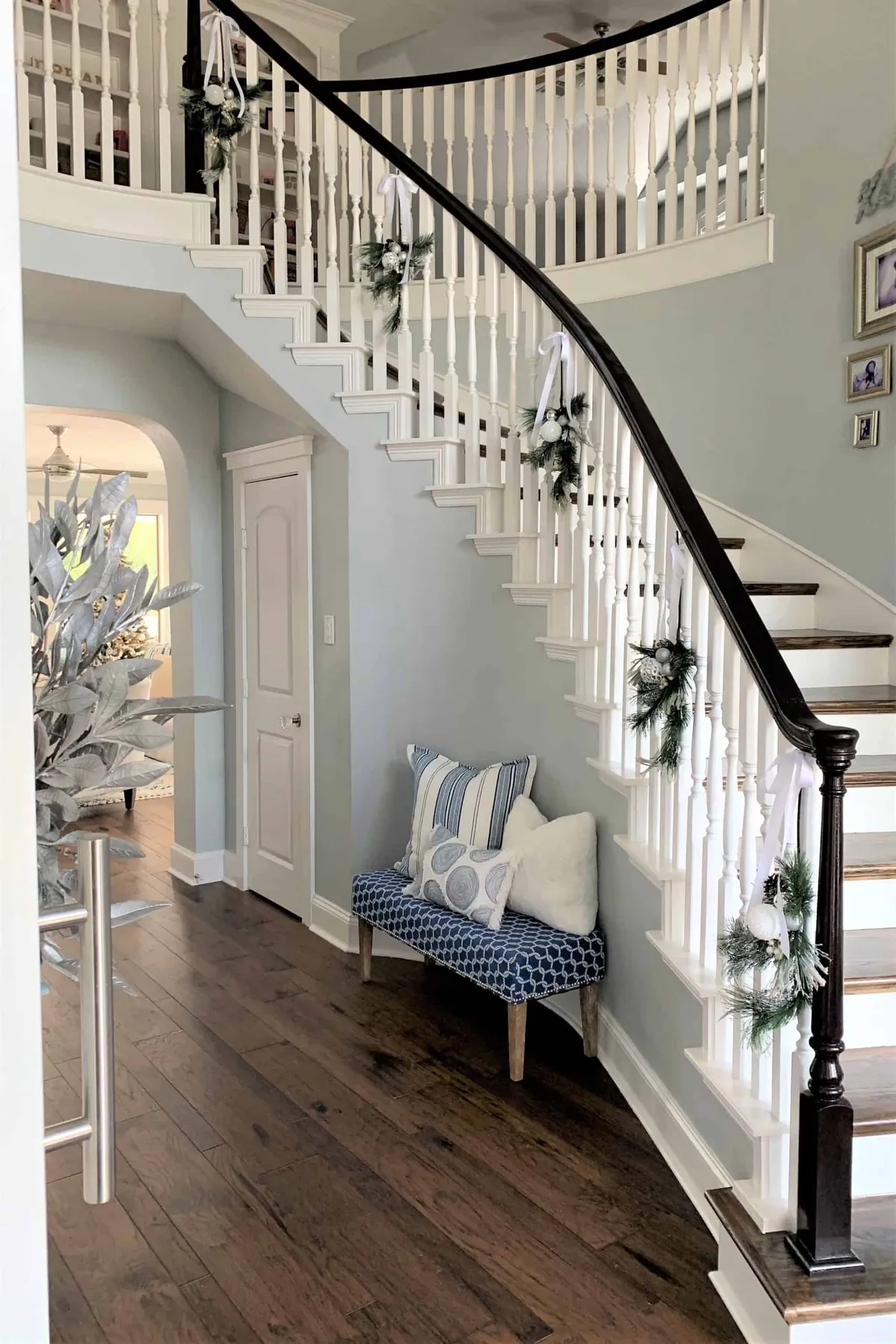 Easy Christmas Staircase Decorating Idea: Pine Sprays -  thetarnishedjewelblog