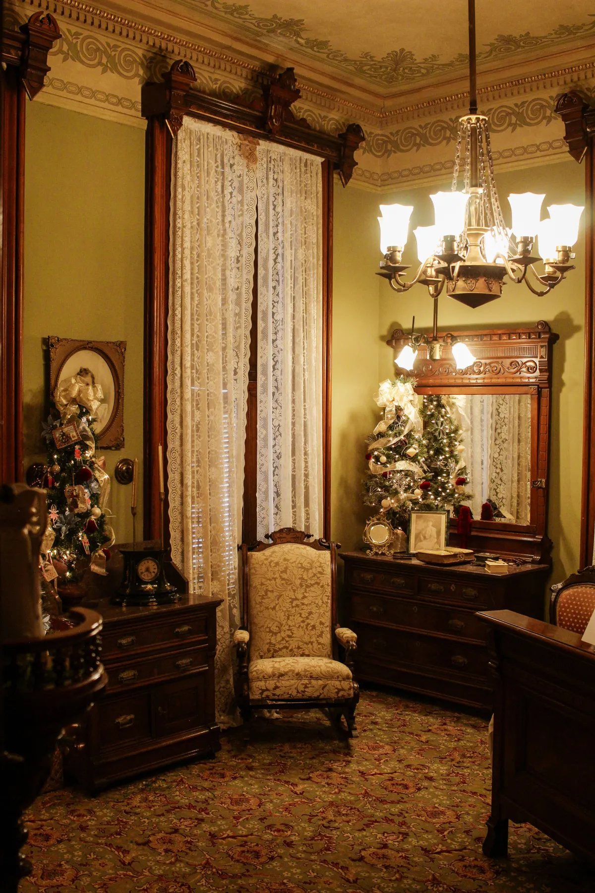 Elegant Victorian room showcasing antique furniture and vintage decor in a historic setting.