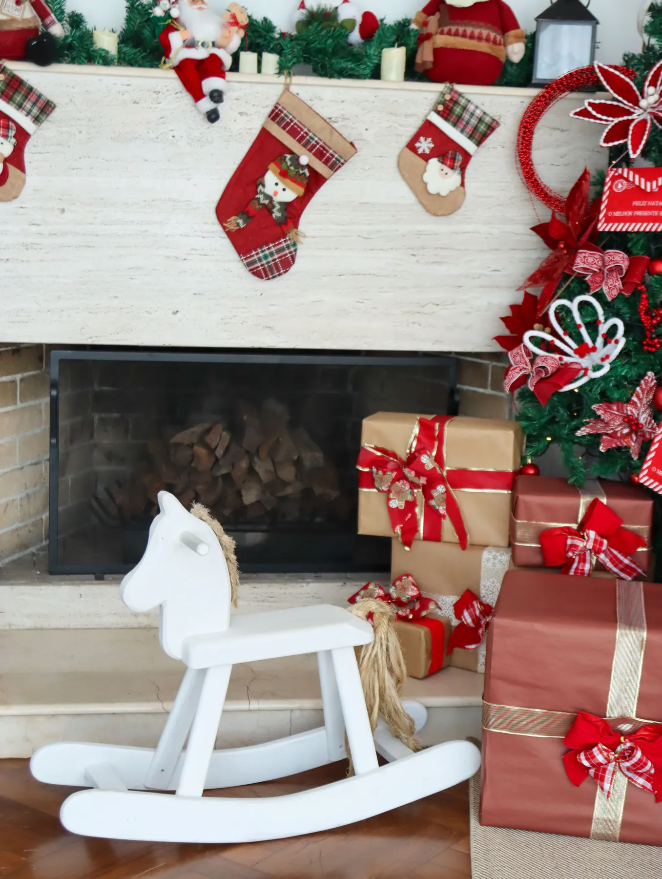 Festive Christmas fireplace decorated with stockings, wreaths, and gifts, capturing a cozy holiday atmosphere.