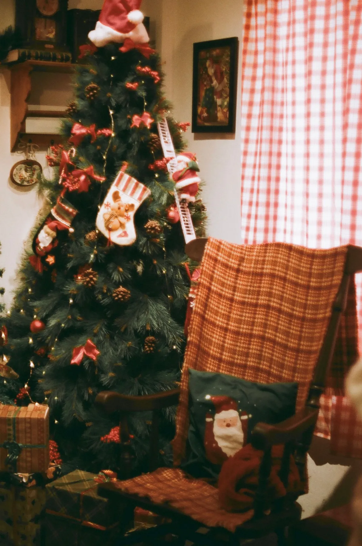 Festive home interior featuring a decorated Christmas tree, stockings, and gifts in a cozy setting.