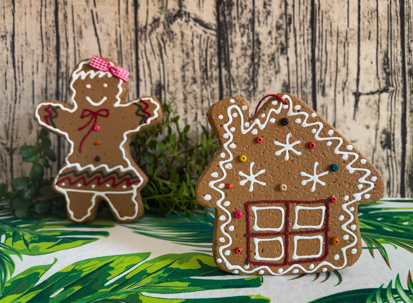 Gingerbread person and house decorations with icing, perfect for Christmas.