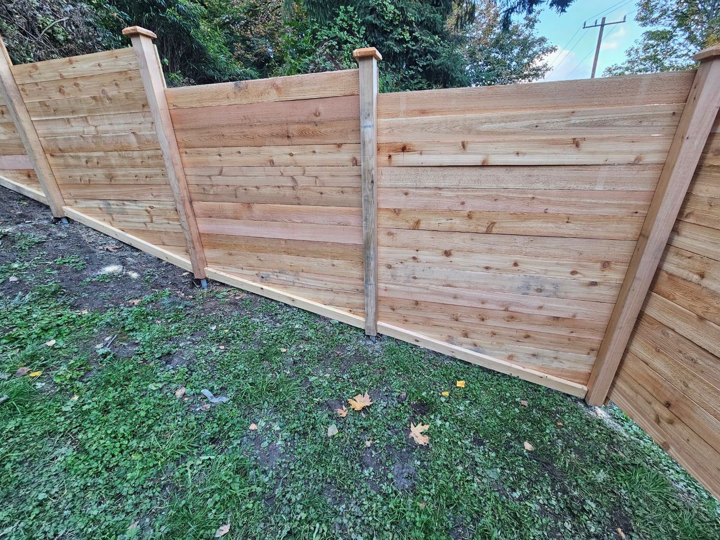 How to build a stepped and sloped fence - Rain City Fence