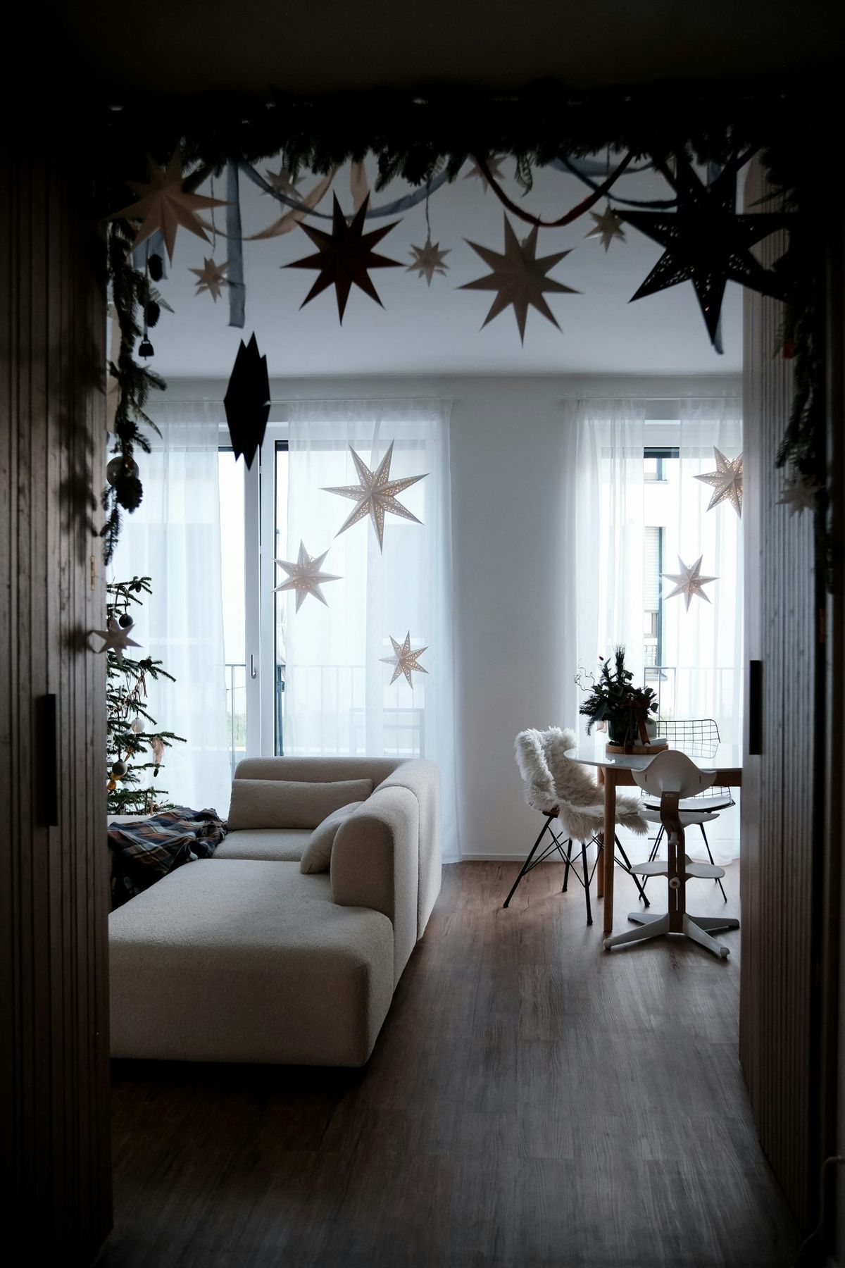 Living room decorated for christmas with stars and tree