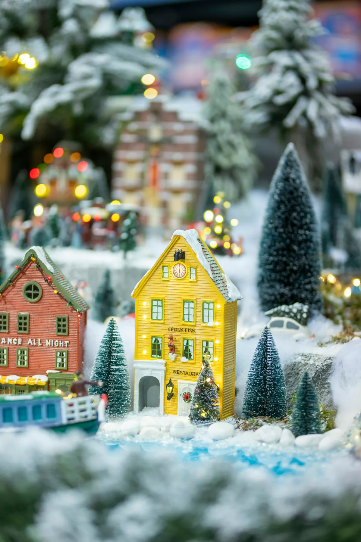 Miniature village scene with snow and christmas lights - Free Photo on  Unsplash