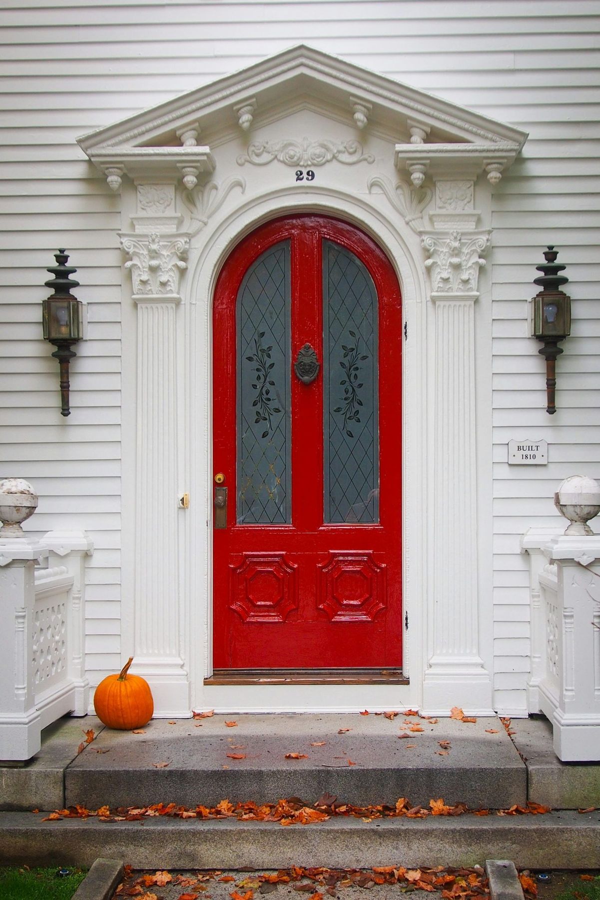 On the Green in Woodstock are many classic homes with inviting entrances. This bright red door portends a lovely New England home on the other side.