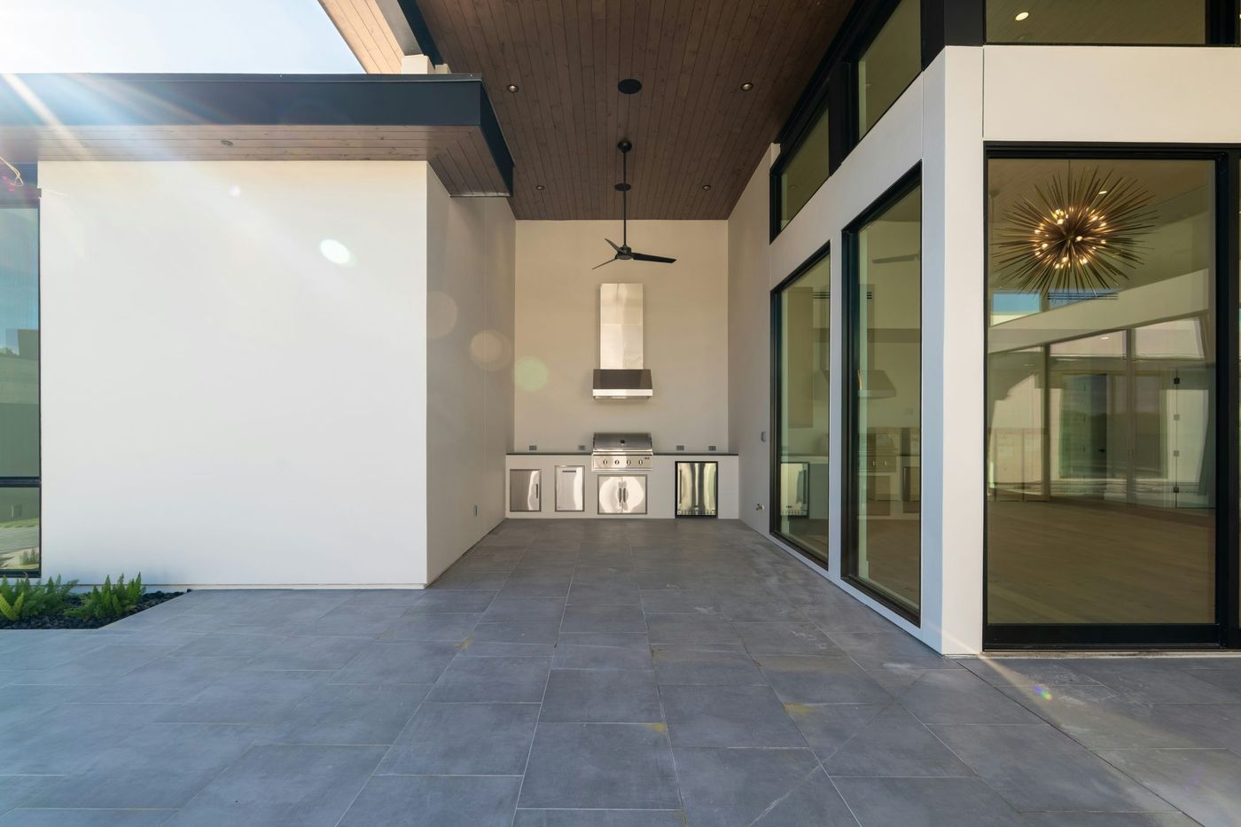 Sleek modern outdoor patio with a built-in kitchen