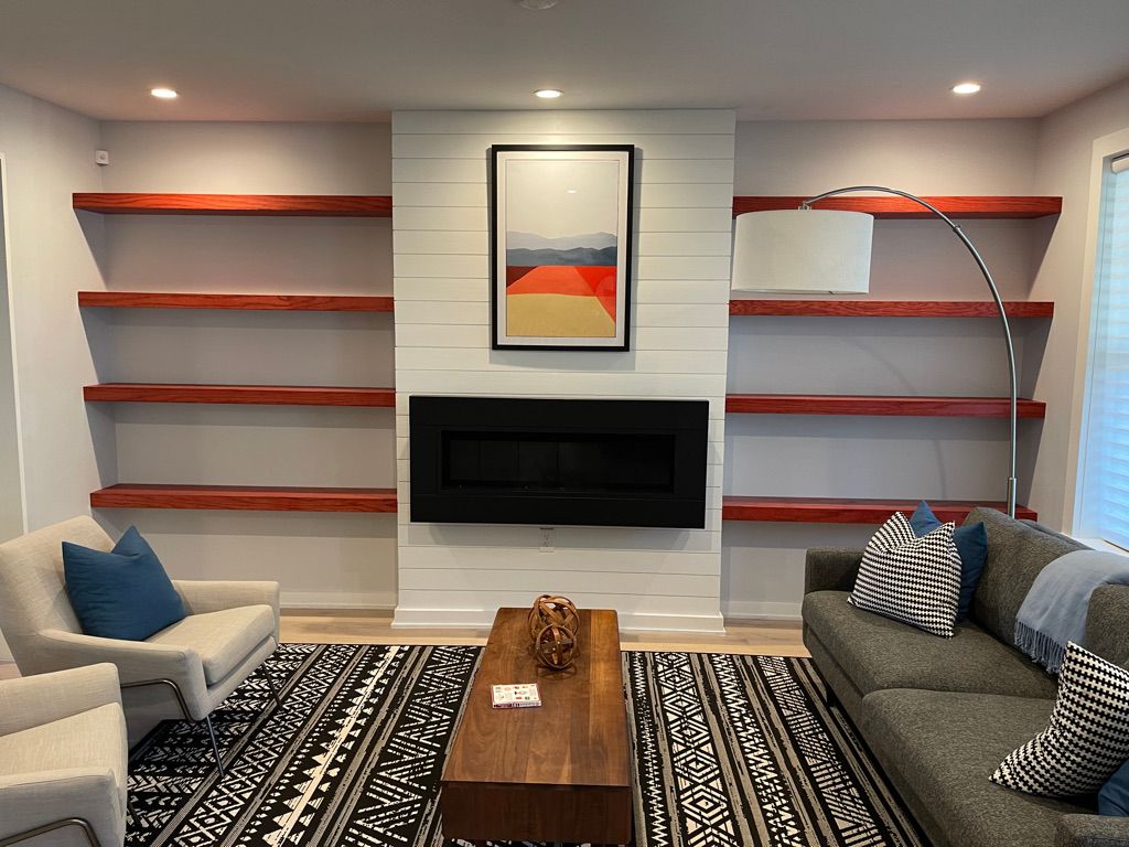 Stained Floating Shelves Surrounding Fireplace – Maryland Carpentry