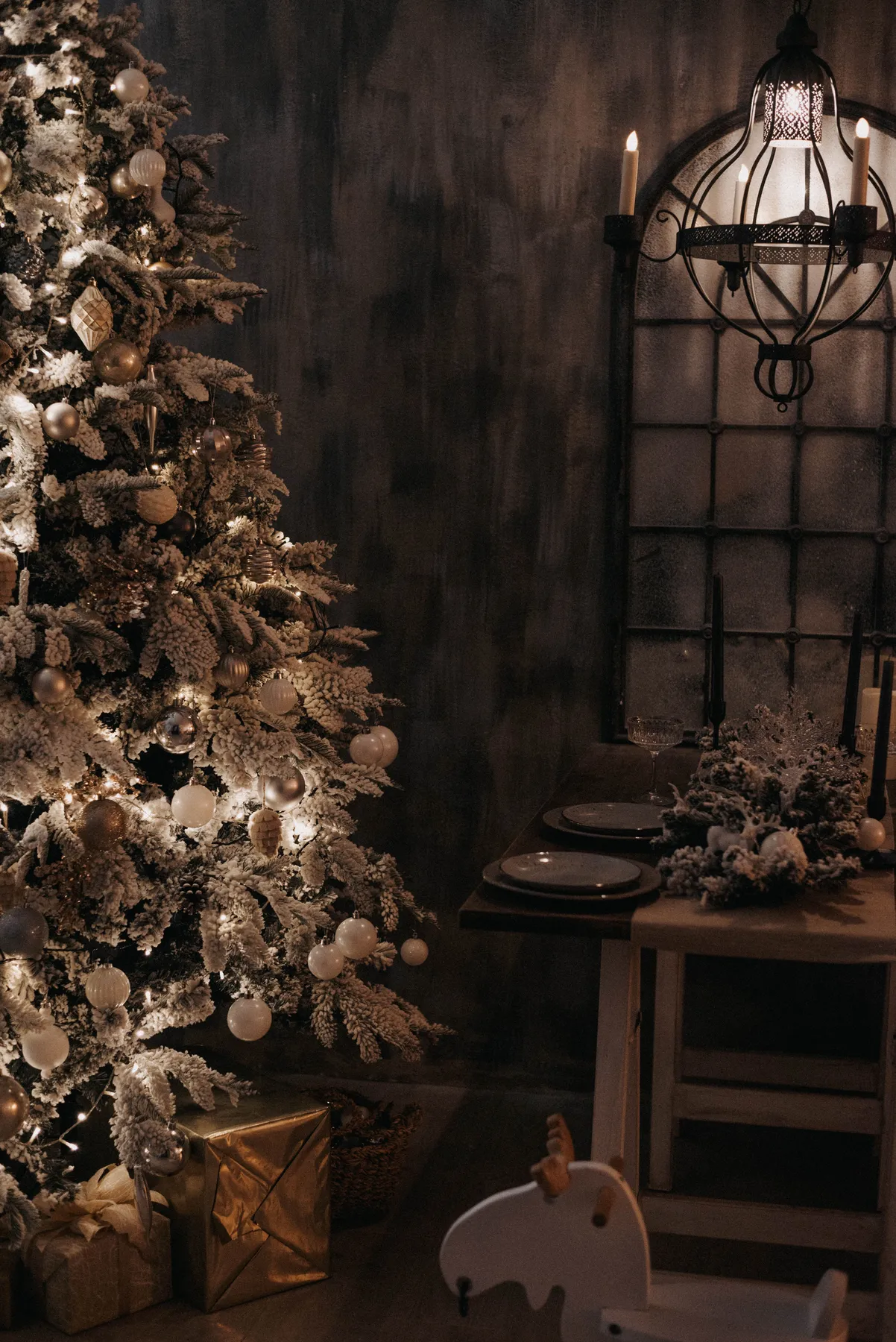 Warm holiday scene with lit Christmas tree and festive decorations indoors.